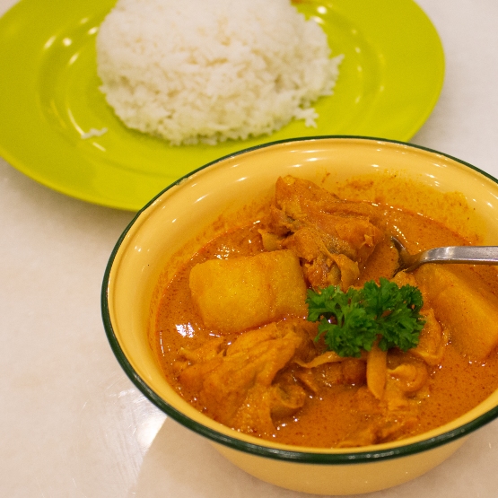 Bowl of curry chicken from Curry Times, served with rice